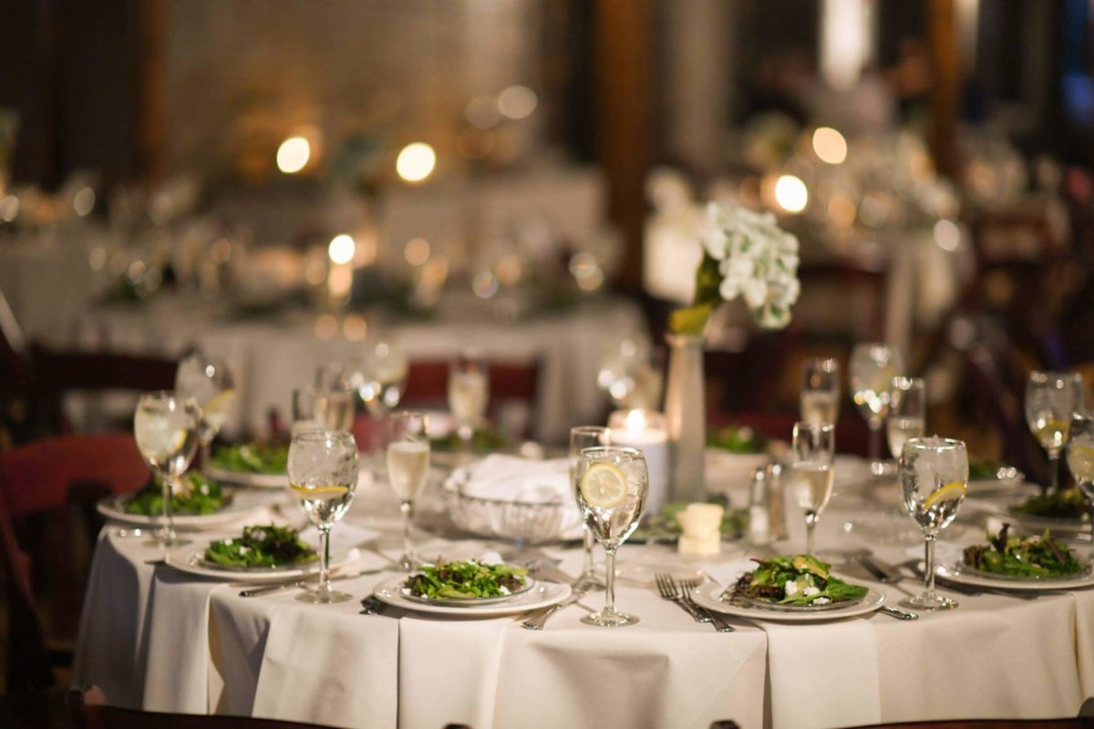 Wedding tables with pre-set salads at off-site wedding